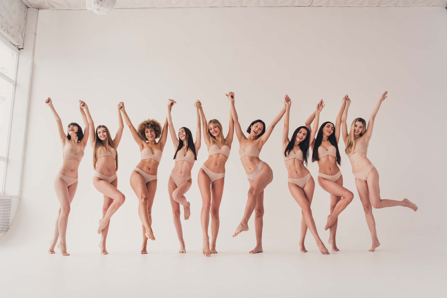 Women posing in tan underwear